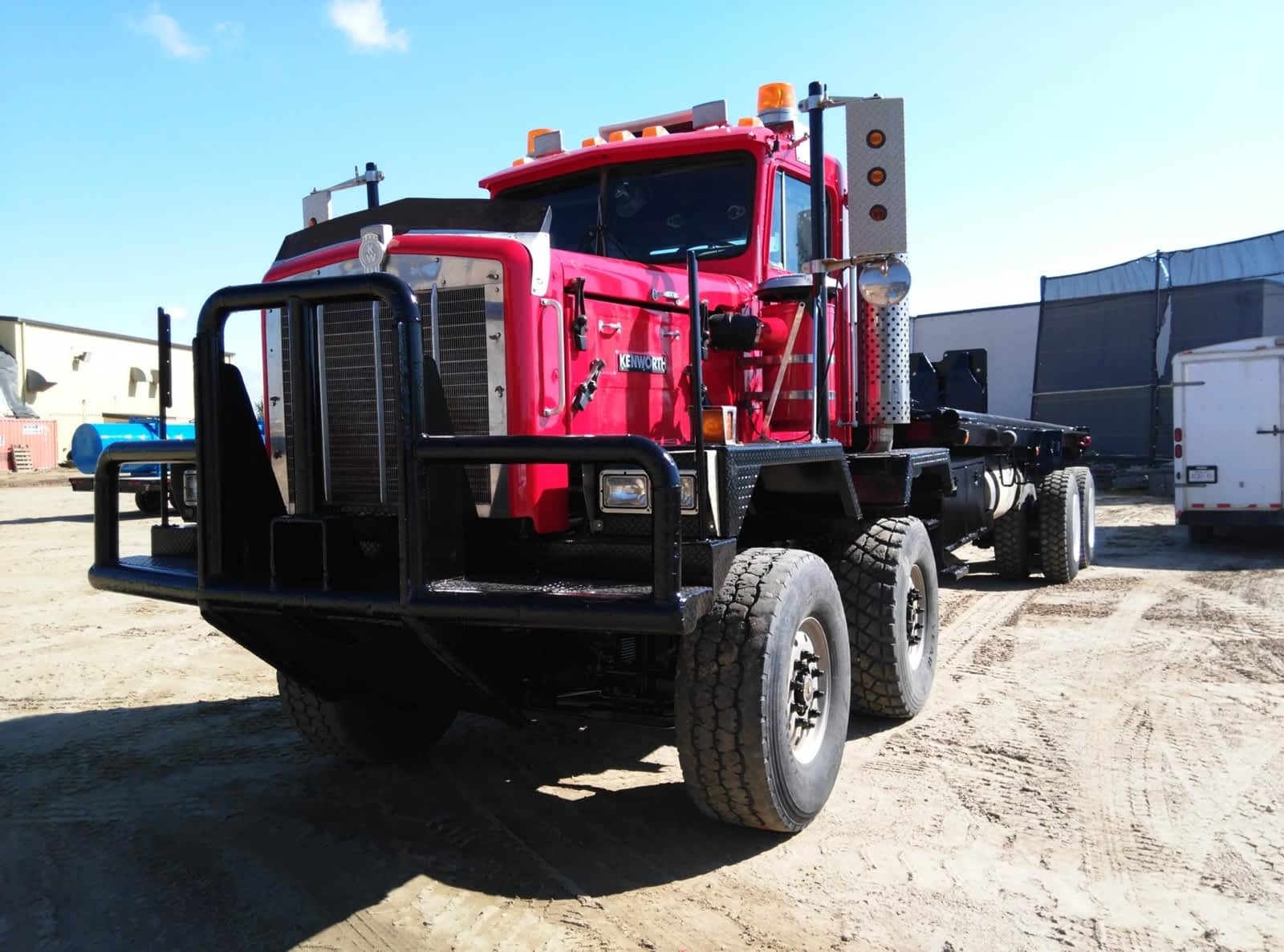 The front view of a red and black bedtruck